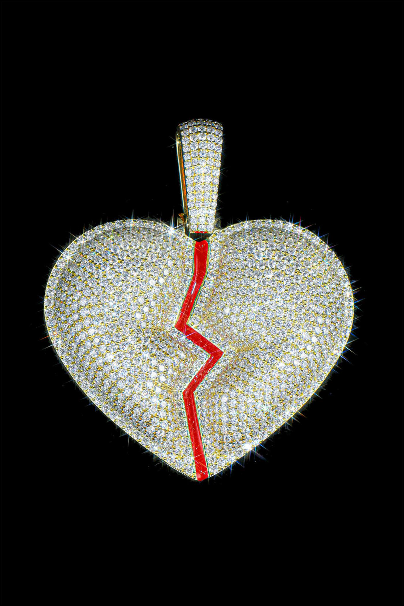 A shattered heart pendant fully inlaid with moissanite