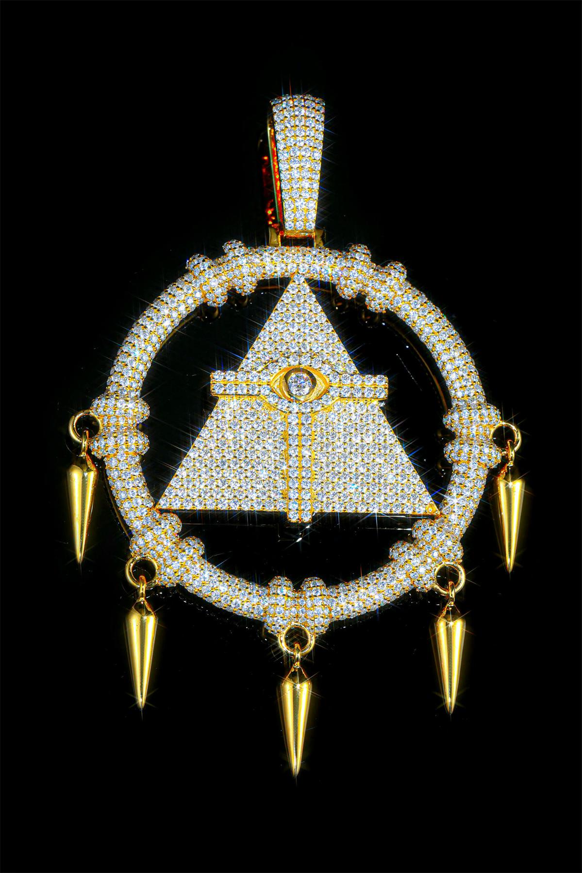 A pendant shaped like the triangular geometric form of the Millennium Puzzle from